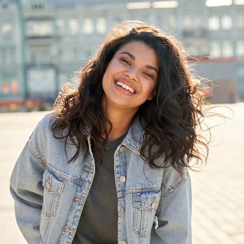 Lady smiles outdoors