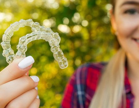 Lady shows off Invisalign clear aligners