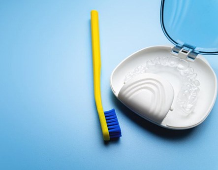 Toothbrush by Invisalign aligner in case