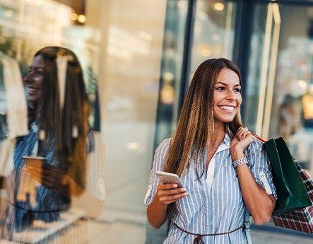 Woman smiling while shopping outside