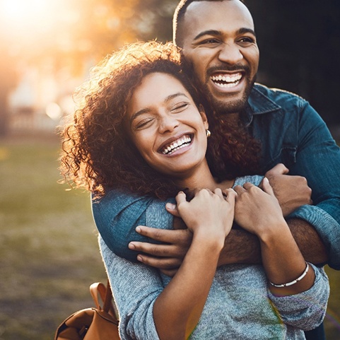 Woman smiling with partner after cosmetic dental bonding in Lewisville