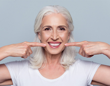 patient smiling after getting dental implants in Lewisville