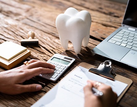 Person budgeting for the cost of dental care