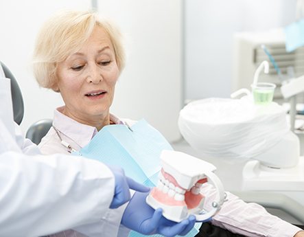 Dentures patient in Lewisville talking to dentist