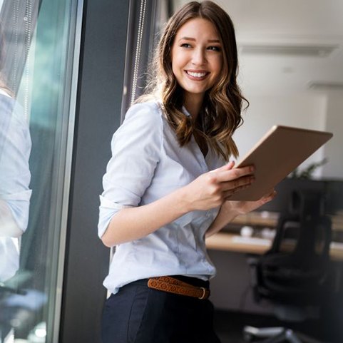 Confident young woman in office setting