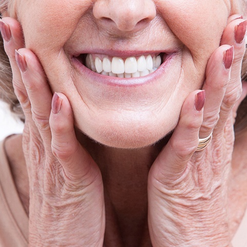 closeup of woman smiling with dental implants 