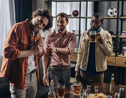 man opening beer with teeth