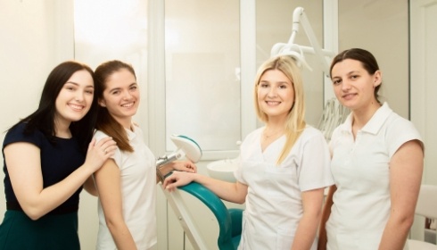 The dental team smiling