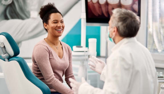 Woman talking to dentist
