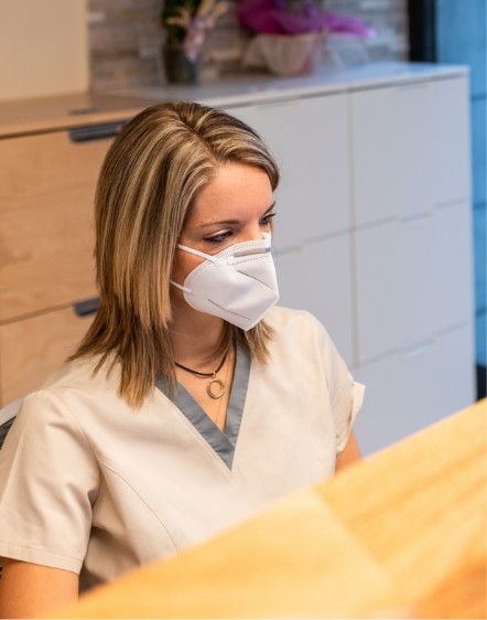 Dental team member sitting at desk