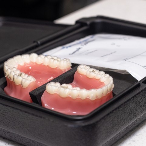 smiling woman with Invisalign in Lewisville