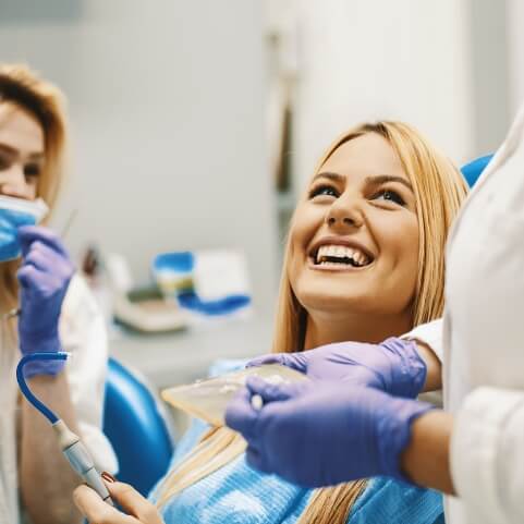 Dental patient smiling at dentist