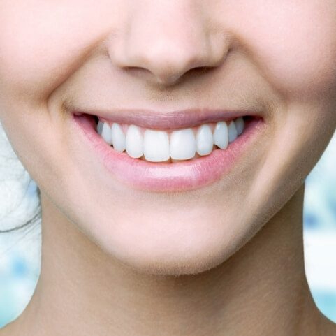 Closeup of healthy smile after periodontal disease treatment