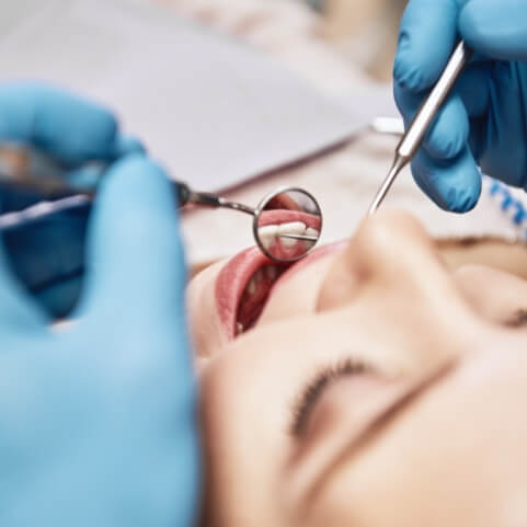 Dental patient receiving oral cancer screening