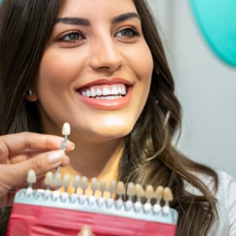 Woman with gorgeous smile after tooth colored fillings