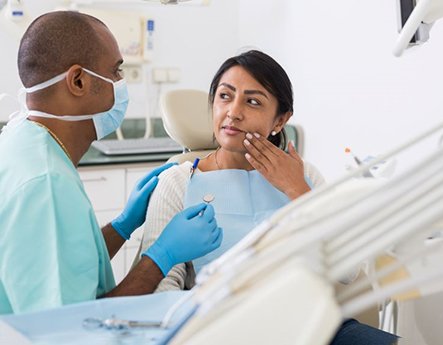 Dentist and patient discussing treatment plan