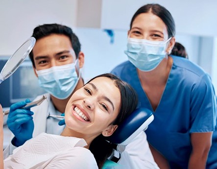 Smiling dental patient, happy she could afford treatment