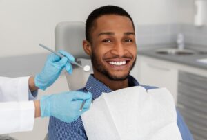 Man smiling after his professional whitening treatment